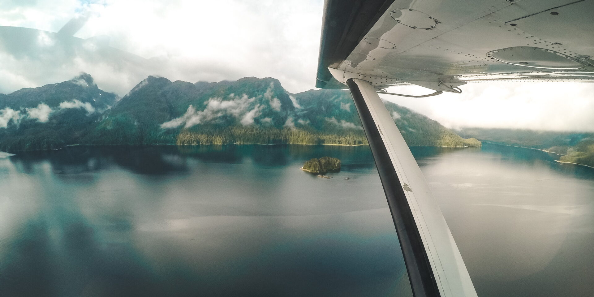 A view of the mountains from inside an airplane.