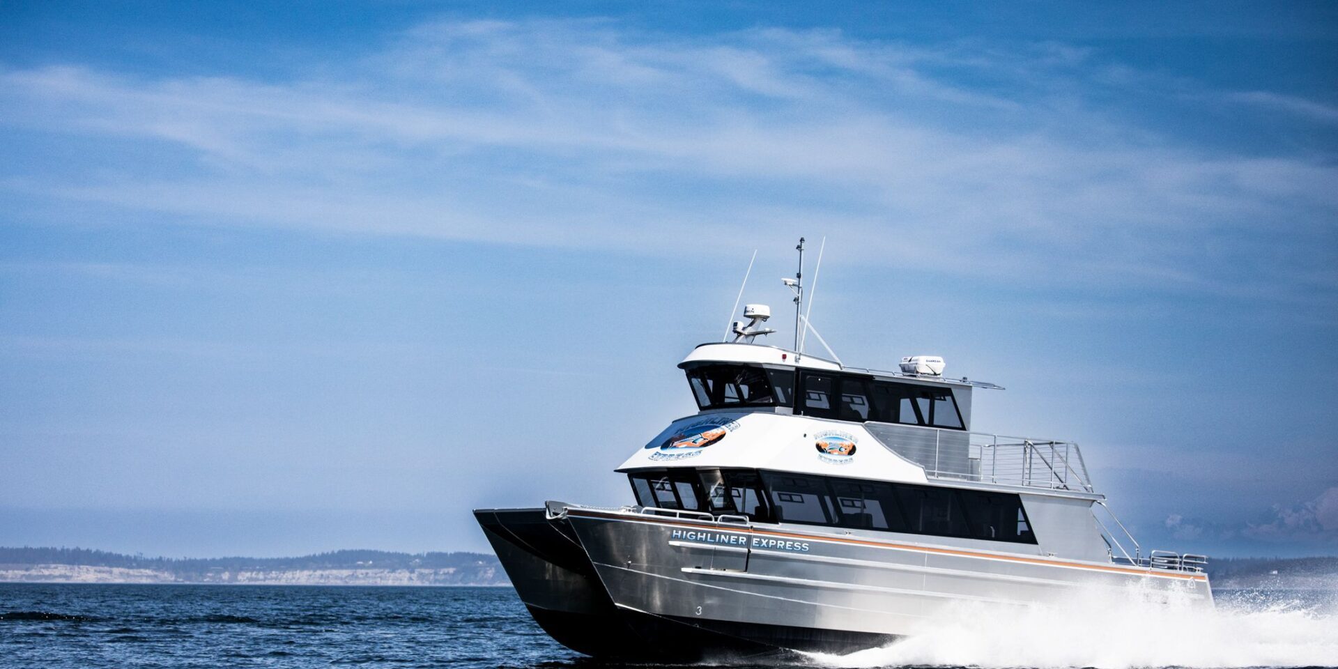 A boat is sailing in the ocean on a sunny day.